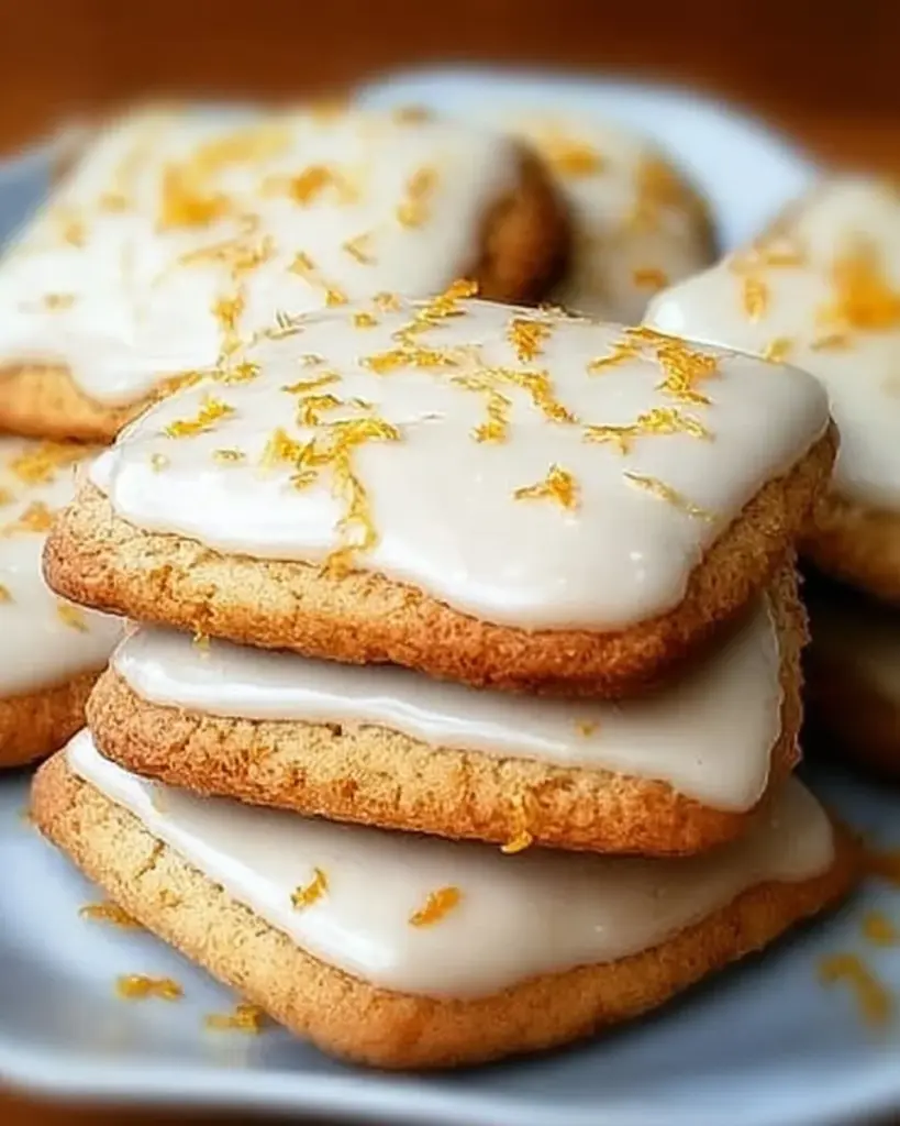 Delicious Cardamom Shortbread cookies topped with orange glaze.