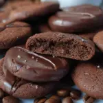 Freshly baked chocolate coffee cookies on a cooling rack