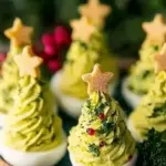 Festively decorated Christmas Tree Deviled Eggs on a platter