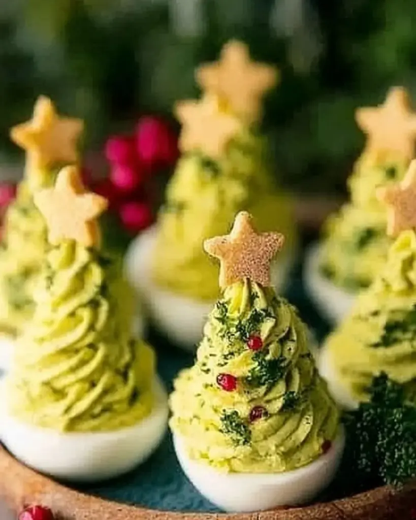 Festively decorated Christmas Tree Deviled Eggs on a platter