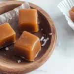Delicious homemade soft chewy caramels in a decorative jar