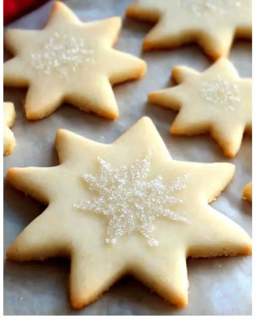 Soft cut out sugar cookies decorated with icing and sprinkles